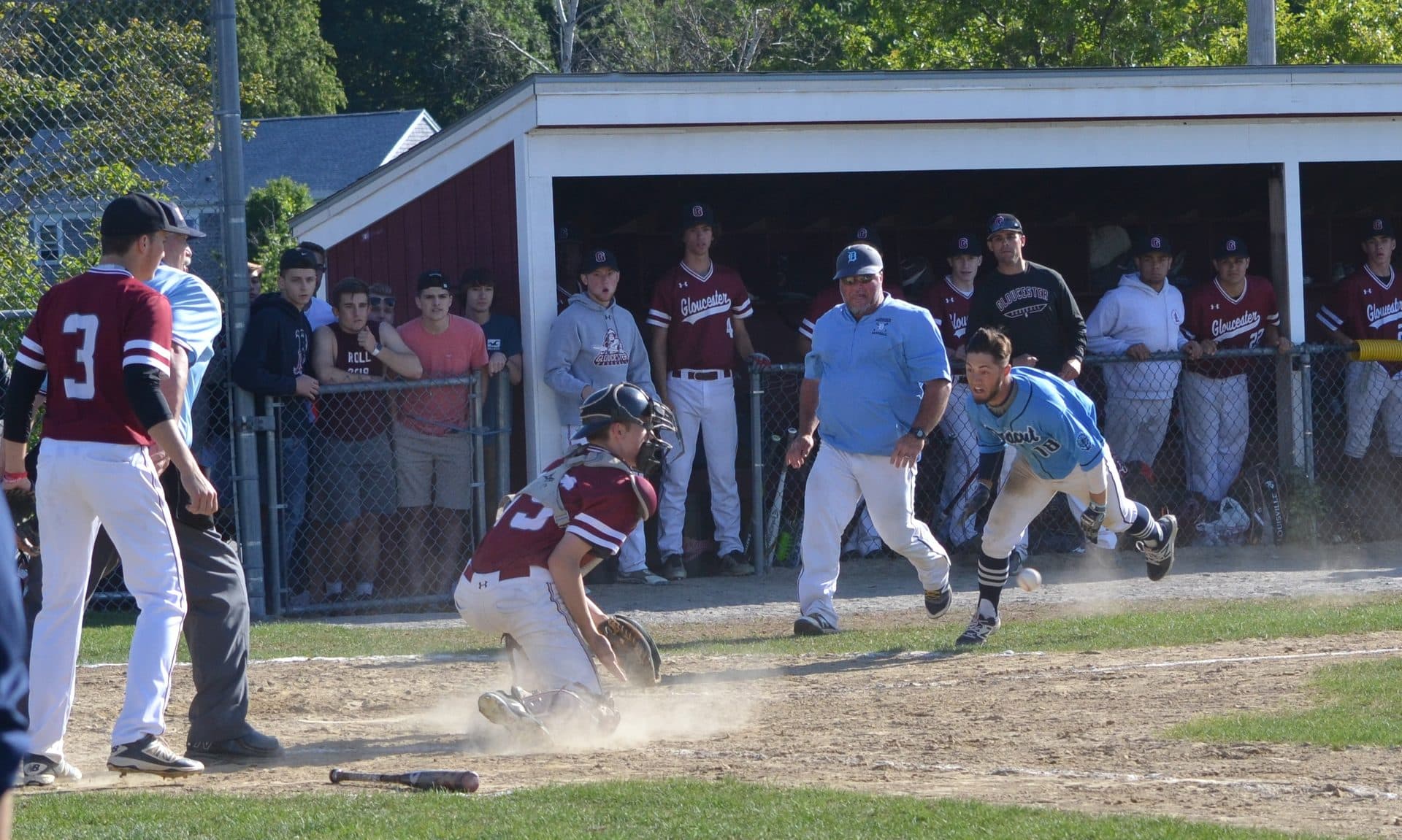 Dracut Middies baseball player sliding into a base